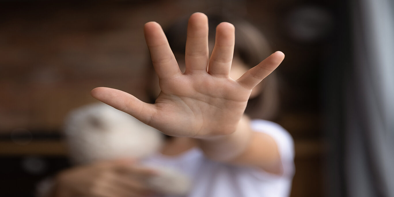 Close up of small girl show ho hand gesture